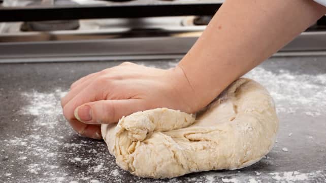 Hand mixing bread dough online
